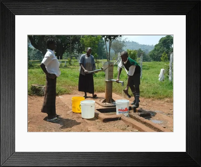 Framed Print : Pumping water at Maseno School Kenya East Africa Framed Print : Pumping water at Maseno School Kenya East Africa