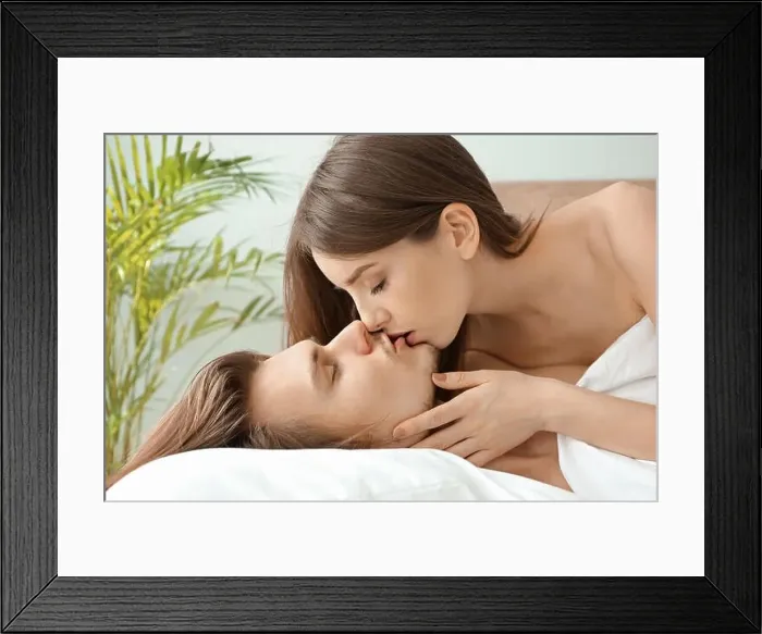 Framed Print : Kissing young couple in bedroom Framed Print : Kissing young couple in bedroom