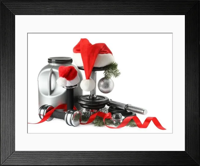 Framed Print : Dumbbells, container with supplement and Christmas decor isolated on white Framed Print : Dumbbells, container with supplement and Christmas decor isolated on white