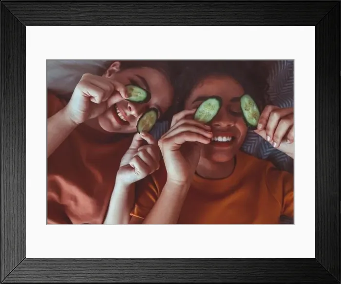 Framed Print : Close up above photo of two best girlfriends spending time together having fun while applying cucumber slices on eyes Framed Print : Close up above photo of two best girlfriends spending time together having fun while applying cucumber slices on eyes