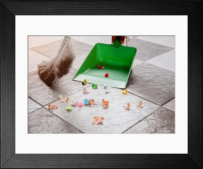 Framed Print : Sweep up scraps of paper and dust on tile floors with a broom and a plastic dustpan Framed Print : Sweep up scraps of paper and dust on tile floors with a broom and a plastic dustpan