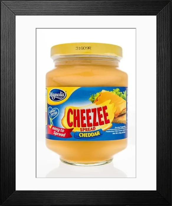 Framed Print : Winneconne, WI - 7 October 2018: A jar of Magnolia cheezee spread on an isolated background Framed Print : Winneconne, WI - 7 October 2018: A jar of Magnolia cheezee spread on an isolated background