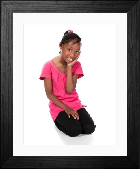 Framed Print : Adorable small african child with braids wearing a bright green shirt and black skinny jeans Framed Print : Adorable small african child with braids wearing a bright green shirt and black skinny jeans