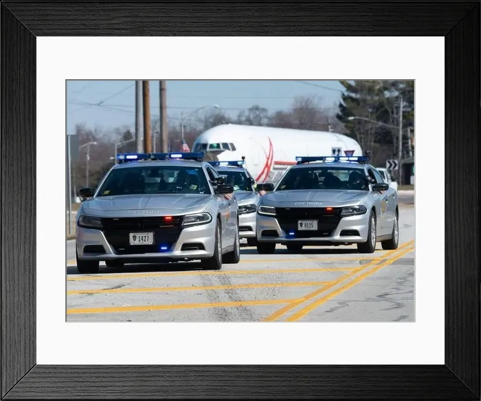 Framed Print : Ohio State Highway Patrol officers escort the fuselage of a Boeing 767 as it moves along Kauffman Avenue in Fairborn Framed Print : Ohio State Highway Patrol officers escort the fuselage of a Boeing 767 as it moves along Kauffman Avenue in Fairborn