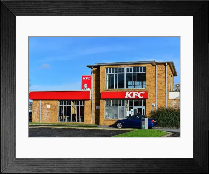 Framed Print : Stock Photo - KFC Kentucky Fried Chicken Drive Thru red sign with Colonel Sanders on roadside with blue sky Framed Print : Stock Photo - KFC Kentucky Fried Chicken Drive Thru red sign with Colonel Sanders on roadside with blue sky