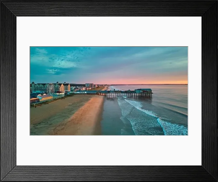 Framed Print : Aerial view over beach in Maine during sunrise with town and old wood pier of shops Framed Print : Aerial view over beach in Maine during sunrise with town and old wood pier of shops