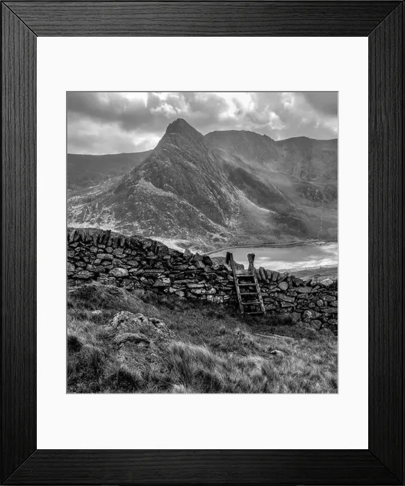 Framed Print : Snowdonia Landscape with Dry Stone Wall and Stile, Lake Ogwen and Tryfan Framed Print : Snowdonia Landscape with Dry Stone Wall and Stile, Lake Ogwen and Tryfan