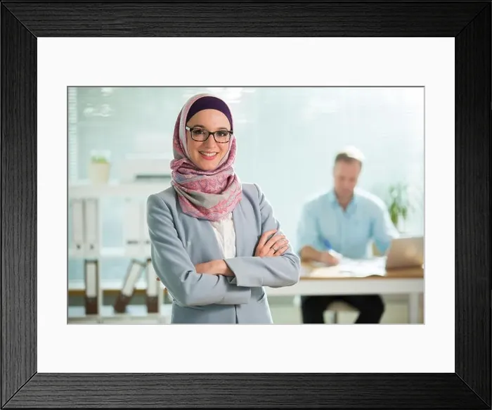 Framed Print : Beautiful young working woman in hijab Framed Print : Beautiful young working woman in hijab