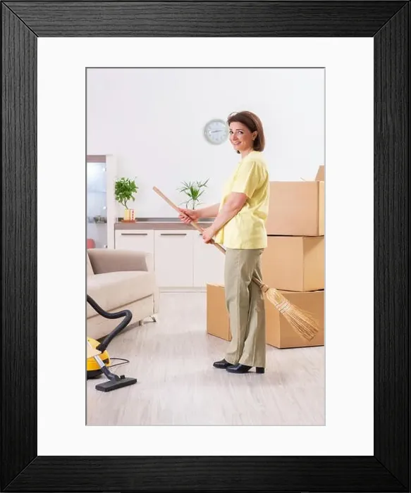 Framed Print : Middle-aged woman cleaning new apartment Framed Print : Middle-aged woman cleaning new apartment