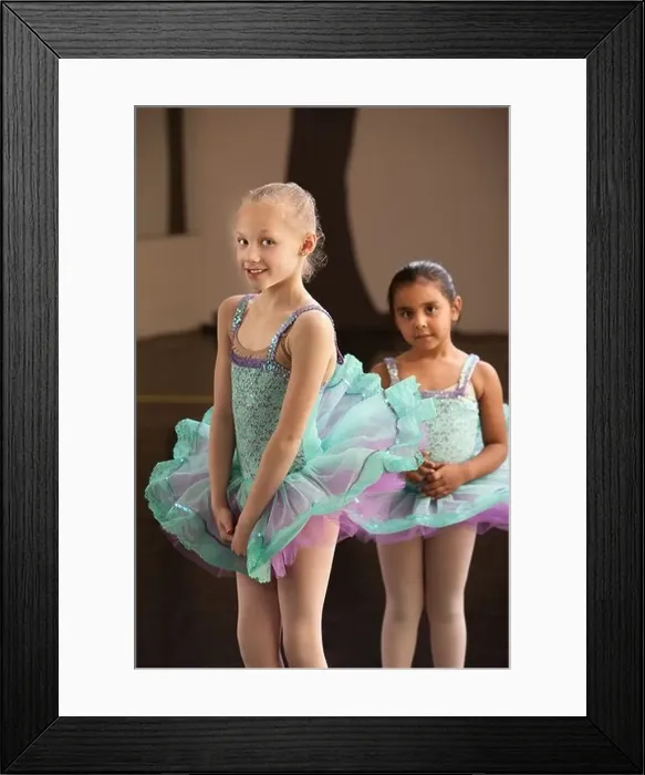 Framed Print : Shy little girls in ballet dresses at a dance studio Framed Print : Shy little girls in ballet dresses at a dance studio