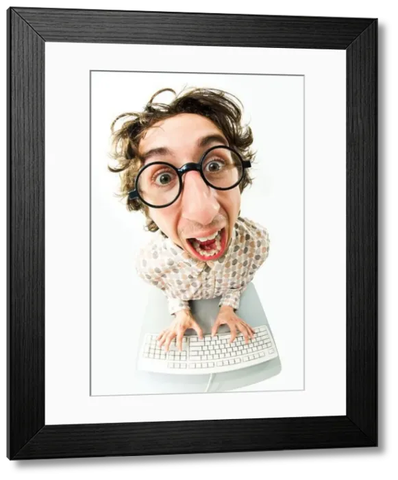 Framed Print : Portrait of funny man screaming during typing a document Framed Print : Portrait of funny man screaming during typing a document