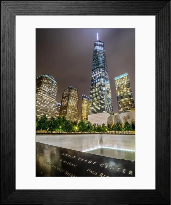 Framed Print : One WTC shines brightly in the background of the 9 / 11 Memorial in Lower Manhttan, New York City
