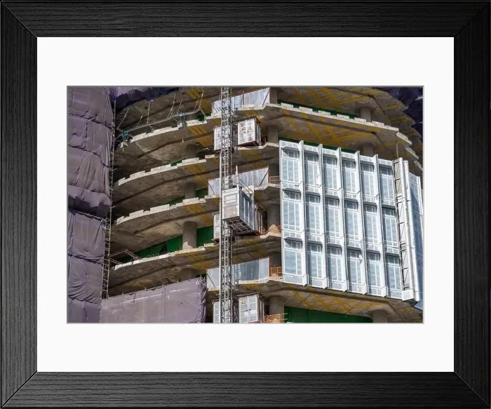 Framed Print : View looking up at a building under construction residential building nearby made of concrete scaffolding Framed Print : View looking up at a building under construction residential building nearby made of concrete scaffolding