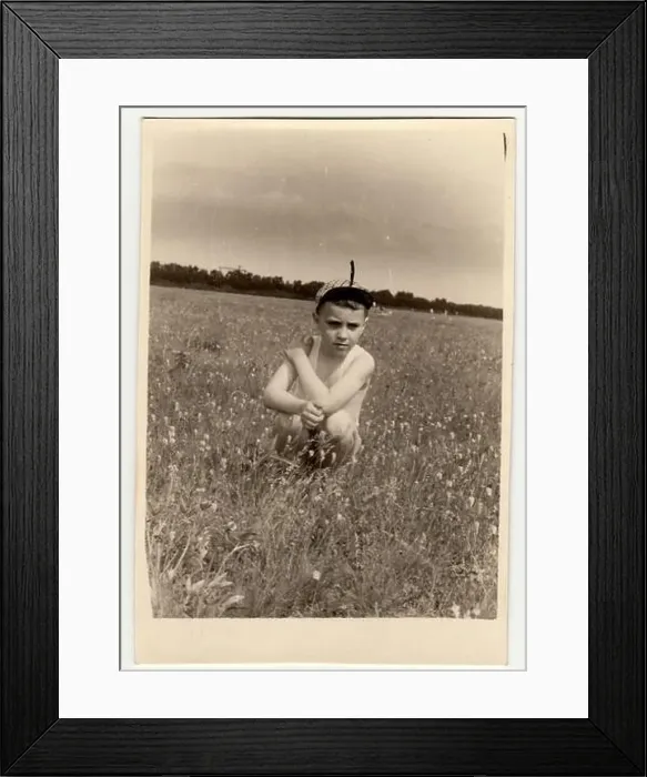 Framed Print : USSR - CIRCA 1980s: Vintage photo shows boy sits on meadow Framed Print : USSR - CIRCA 1980s: Vintage photo shows boy sits on meadow
