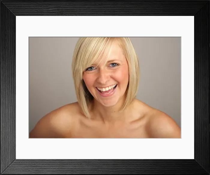 Framed Print : A head and shoulders shot of a pretty blonde girl laughing Framed Print : A head and shoulders shot of a pretty blonde girl laughing