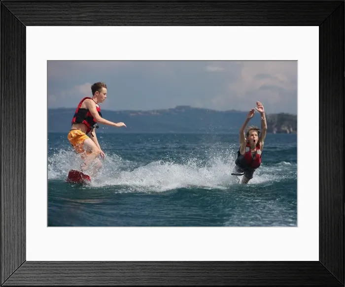 Framed Print : Capodimonte, Italy, boys fall into the water while skiing on Lake Bolsena Framed Print : Capodimonte, Italy, boys fall into the water while skiing on Lake Bolsena