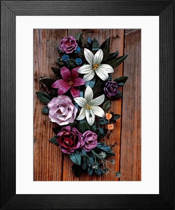 Framed Print : Bouquet of metal flowers attached to a wooden door Framed Print : Bouquet of metal flowers attached to a wooden door
