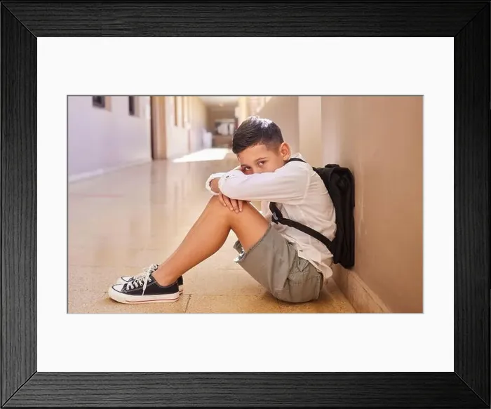 Framed Print : School child, bullying and sad student on ground for depression Framed Print : School child, bullying and sad student on ground for depression