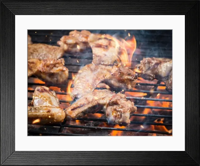 Framed Print : Chicken wings on barbecue grill with fire Framed Print : Chicken wings on barbecue grill with fire