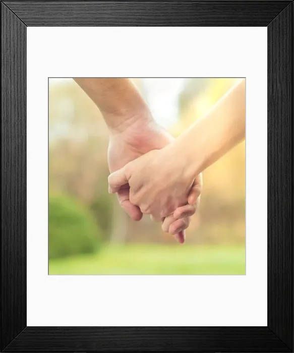 Framed Print : Two hands together, a man and a woman holding hands. Husband and wife together. Support and understanding