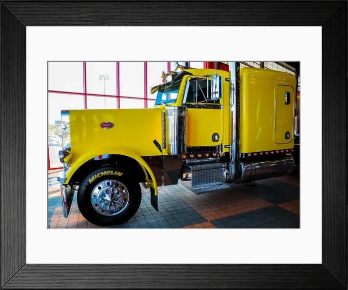 Framed Print : OMAHA, NEBRASKA - FEBRUARY 24, 2010 - Yellow Peterbilt 379 semi truck displayed at IOWA 80 Truckstop Framed Print : OMAHA, NEBRASKA - FEBRUARY 24, 2010 - Yellow Peterbilt 379 semi truck displayed at IOWA 80 Truckstop