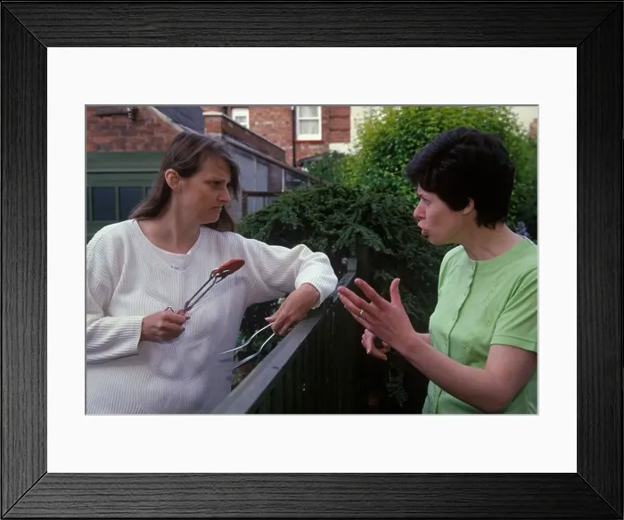 Framed Print : neighbours fighting over the fence about a bbq Framed Print : neighbours fighting over the fence about a bbq