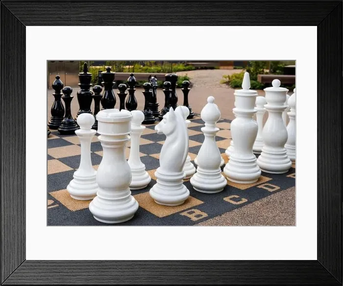 Framed Print : Outdoor chess board with big plastic pieces Framed Print : Outdoor chess board with big plastic pieces