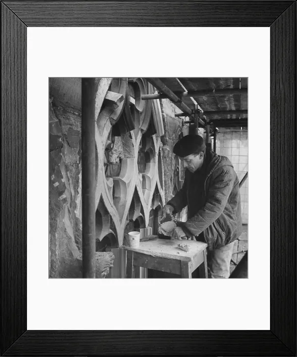 Framed Print : A stonemason working at Carlisle Cathedral applying SBD Certite during restoration on the tracery of a window Framed Print : A stonemason working at Carlisle Cathedral applying SBD Certite during restoration on the tracery of a window