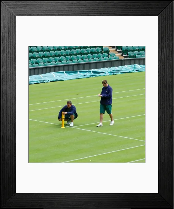 Framed Print : London, UK. 14th June 2013. Groundsmen check the level of the grass on Centre Court at the All England Club Framed Print : London, UK. 14th June 2013. Groundsmen check the level of the grass on Centre Court at the All England Club
