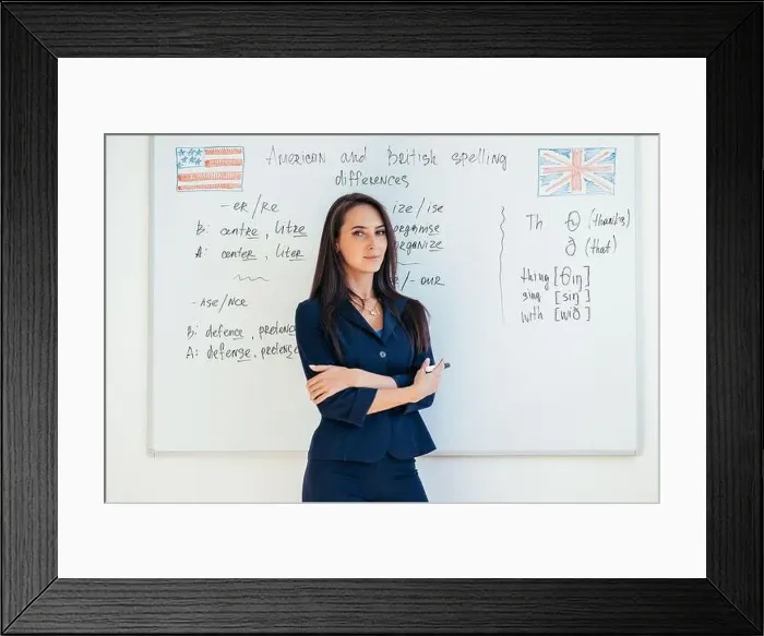 Framed Print : Portrait of female english teacher in front of whiteboard Framed Print : Portrait of female english teacher in front of whiteboard