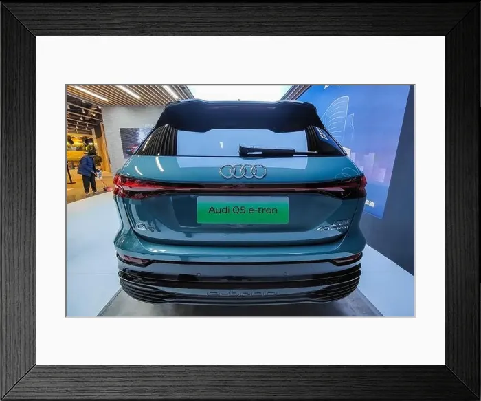 Framed Print : SHANGHAI, CHINA - DECEMBER 31, 2021 - An Audi Q5 E-tron electric vehicle is seen in Shanghai Framed Print : SHANGHAI, CHINA - DECEMBER 31, 2021 - An Audi Q5 E-tron electric vehicle is seen in Shanghai