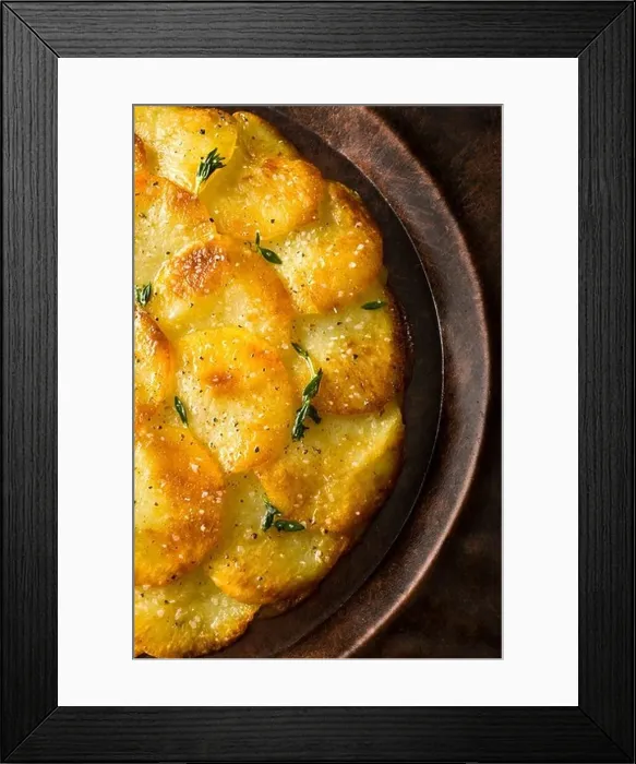 Framed Print : Potato Galettes or Anna garnished with fresh thyme, salt and pepper and served on a rustic plate Framed Print : Potato Galettes or Anna garnished with fresh thyme, salt and pepper and served on a rustic plate