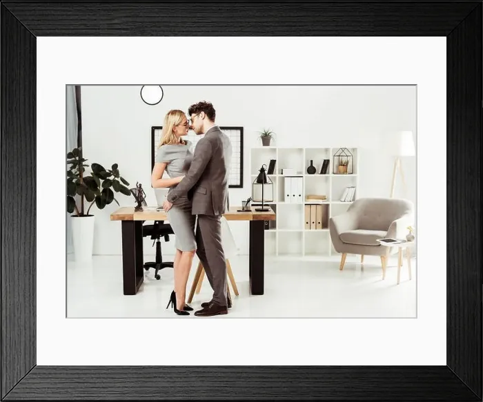 Framed Print : young lawyers hugging each other while standing in office, flirt and office romance concept