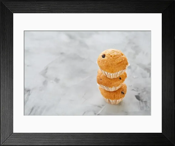 Framed Print : Tasty vanilla muffins arranged in pattern on light textured background Framed Print : Tasty vanilla muffins arranged in pattern on light textured background