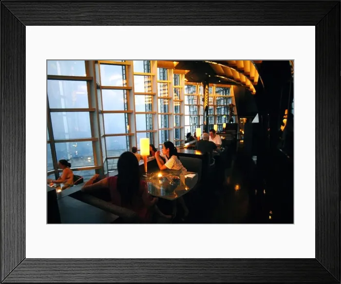 Framed Print : Customers are pictured at Cloud 9 Bar in the Grand Hyatt Shanghai in Jinmao Tower in the Lujiazui Financial District in Framed Print : Customers are pictured at Cloud 9 Bar in the Grand Hyatt Shanghai in Jinmao Tower in the Lujiazui Financial District in
