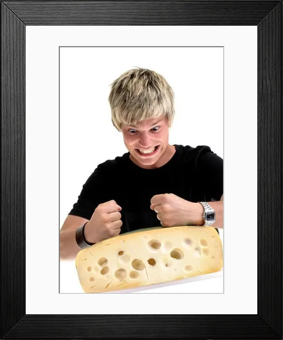 Framed Print : In-your-face guy: young man pounding on a cheese wheel