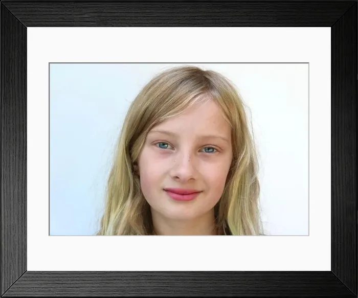 Framed Print : Portrait of an adolescent girl with a content smile Framed Print : Portrait of an adolescent girl with a content smile