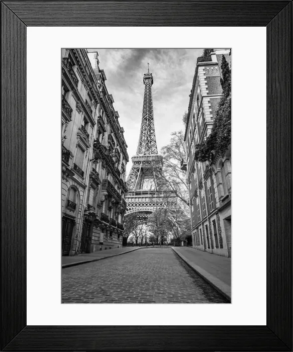 Framed Print : View of the Eiffel Tower from a nearby street full of residential buildings. Paris, France. Black and white photography Framed Print : View of the Eiffel Tower from a nearby street full of residential buildings. Paris, France. Black and white photography