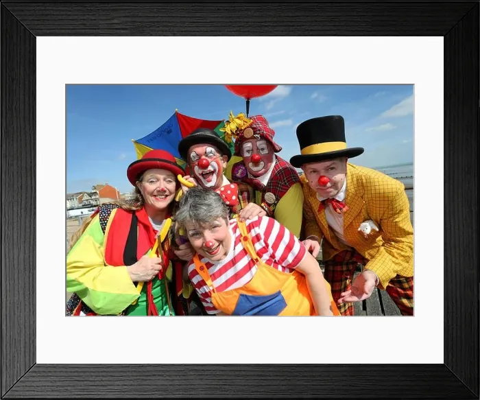 Framed Print : Clowns performing in the Bognor Regis Clowns Festival 2017 pictured on Bognor Regis Pier in the sun to promote Framed Print : Clowns performing in the Bognor Regis Clowns Festival 2017 pictured on Bognor Regis Pier in the sun to promote