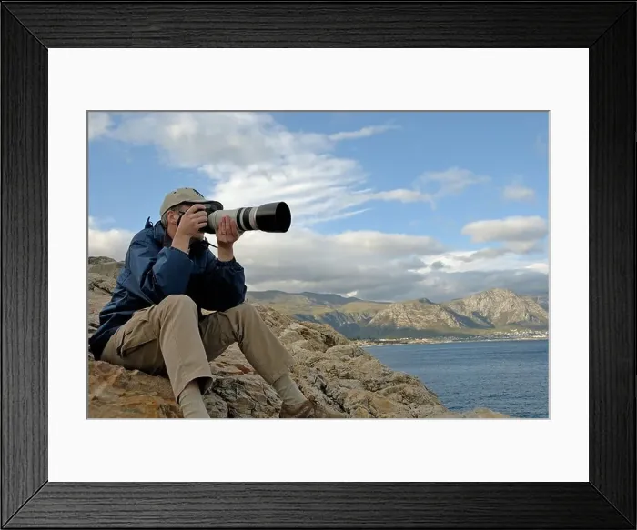 Framed Print : Man photographer taking a photograph of a landscape with telephoto lens, South Western Cape, South Africa Framed Print : Man photographer taking a photograph of a landscape with telephoto lens, South Western Cape, South Africa