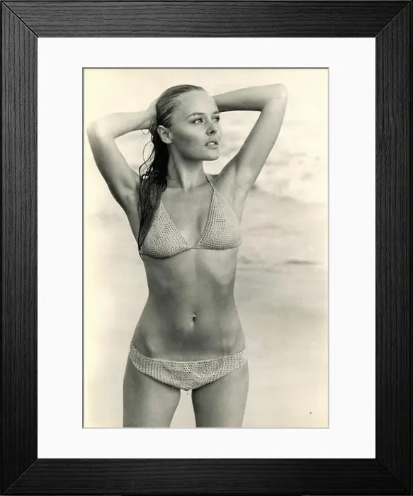 Framed Print : Young woman on the beach wearing a bikini, 1970s Framed Print : Young woman on the beach wearing a bikini, 1970s