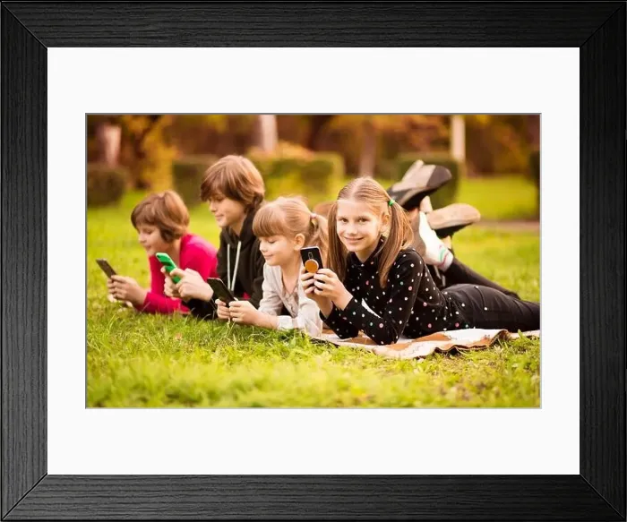 Framed Print : Child girl play internet game with group of friends Framed Print : Child girl play internet game with group of friends