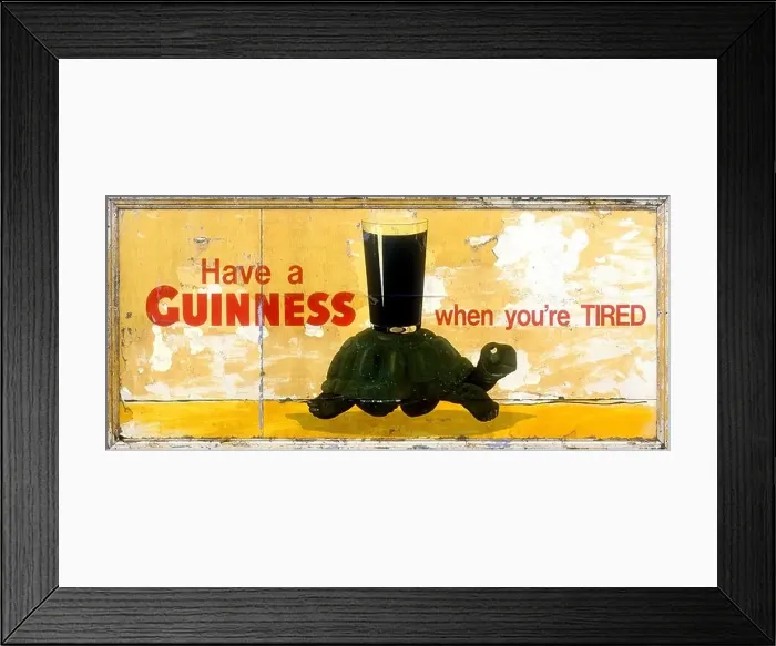 Framed Print : An old guinness poster featuring a tortoise carrying a pint Have a Guinness when you re tired Framed Print : An old guinness poster featuring a tortoise carrying a pint Have a Guinness when you re tired