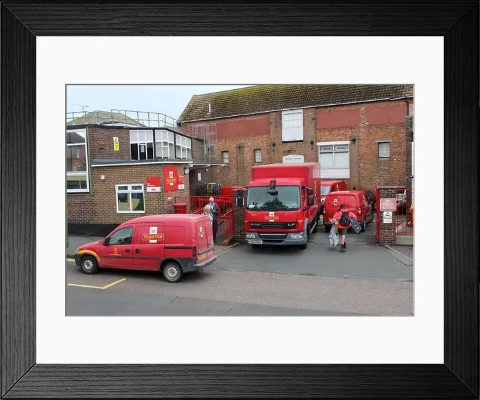 Framed Print : A BUSY SCENE WITH RED ROYAL MAIL DELIVERY VANS AND TRUCK OUTSIDE A TOWN CENTRE DELIVERY OFFICE IN RYE, EAST SUSSEX Framed Print : A BUSY SCENE WITH RED ROYAL MAIL DELIVERY VANS AND TRUCK OUTSIDE A TOWN CENTRE DELIVERY OFFICE IN RYE, EAST SUSSEX