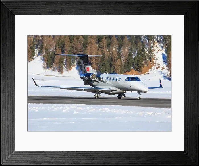 Framed Print : Samedan / Switzerlad: Embraer Phenom 100 at Engadin Airport in Samedan / Switzerland 18.02.2017 Framed Print : Samedan / Switzerlad: Embraer Phenom 100 at Engadin Airport in Samedan / Switzerland 18.02.2017