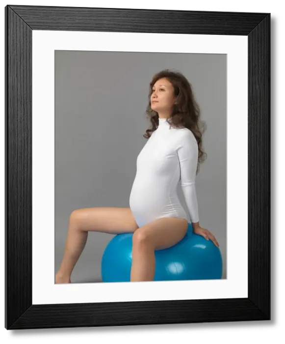 Framed Print : Pregnant young woman with a fitness ball Framed Print : Pregnant young woman with a fitness ball