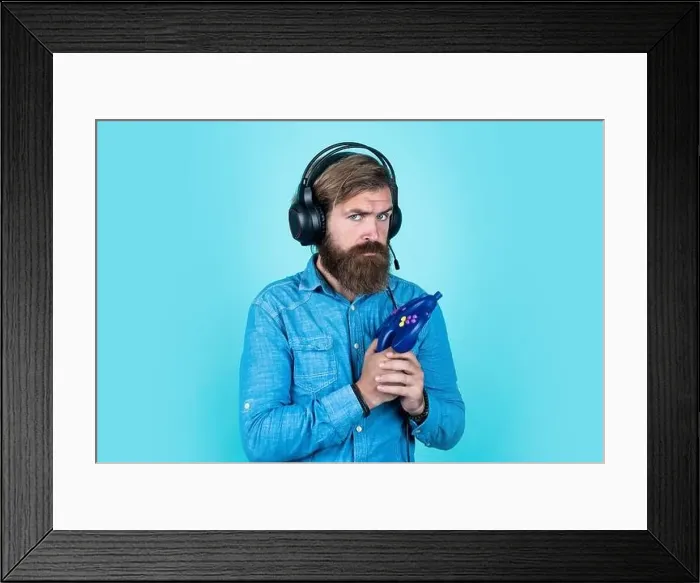 Framed Print : action game. just have fun. unshaven guy play computer games Framed Print : action game. just have fun. unshaven guy play computer games