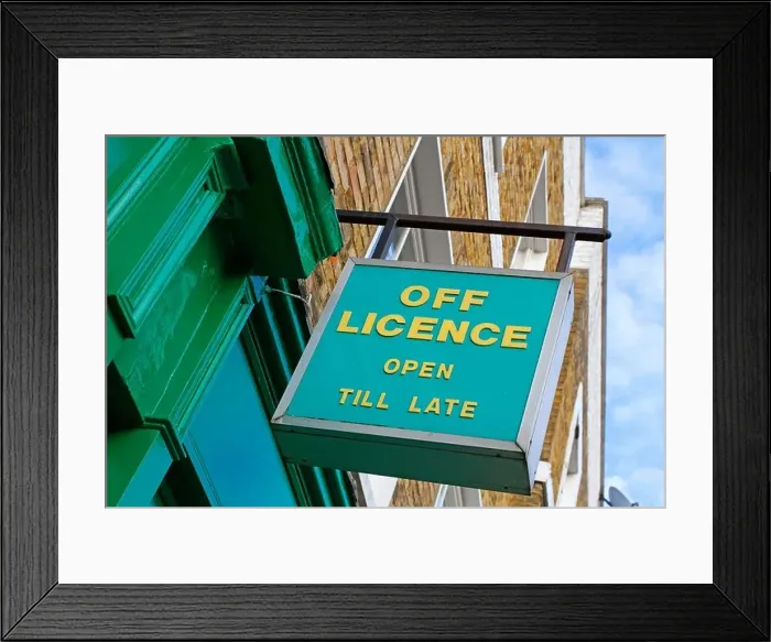 Framed Print : Off Licence Open Till Late sign outside a shop Framed Print : Off Licence Open Till Late sign outside a shop