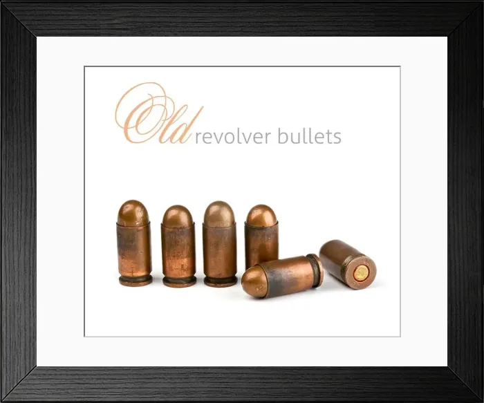 Framed Print : old revolver bullets on a white background Framed Print : old revolver bullets on a white background
