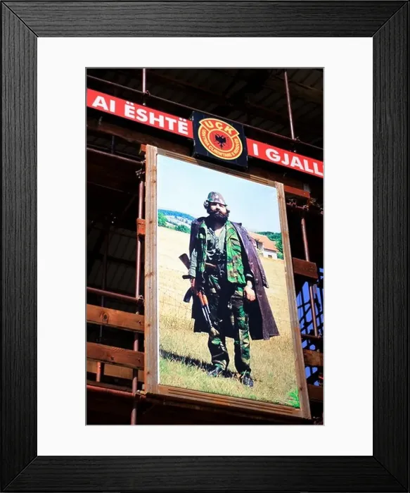 Framed Print : In the memorial place in Prekaz in front of the picture of freedom fighter Adem Jashari Framed Print : In the memorial place in Prekaz in front of the picture of freedom fighter Adem Jashari